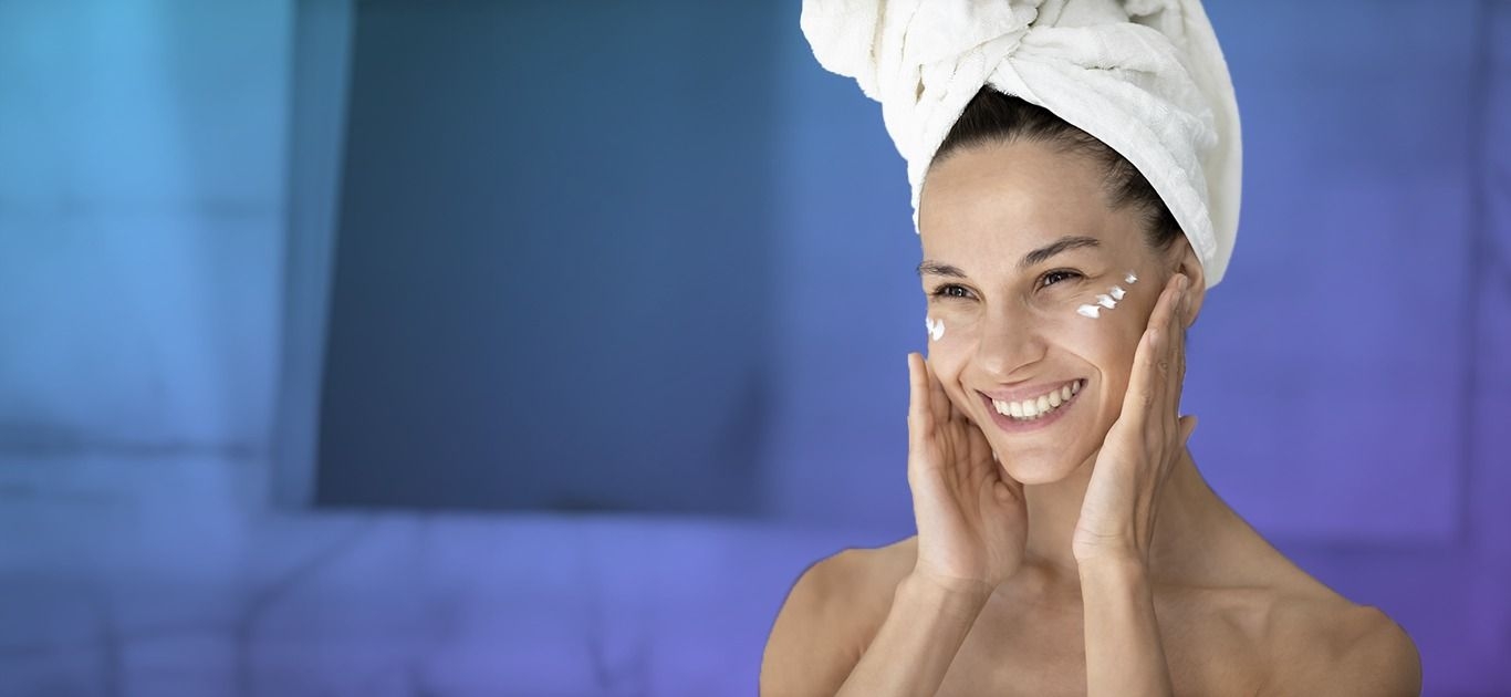 Woman with happy face and a towel on the head