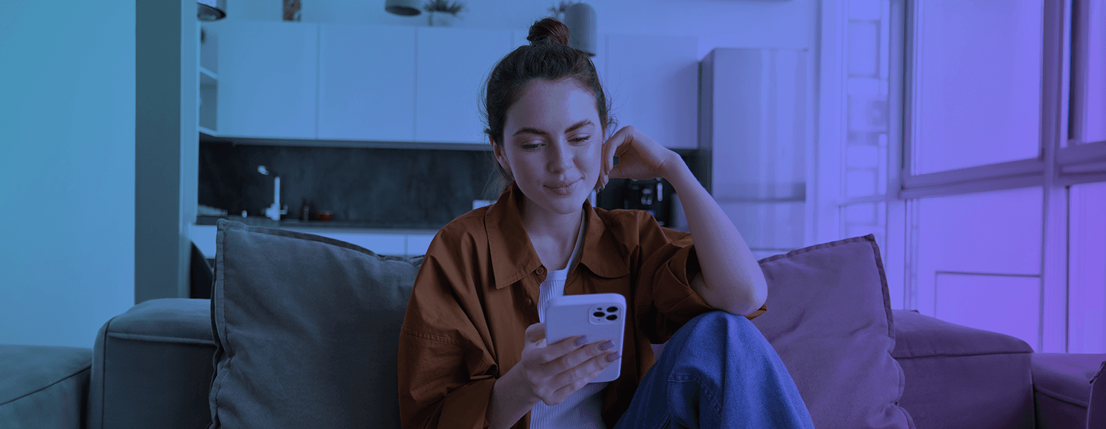 Woman sitting on a couch, making a journey